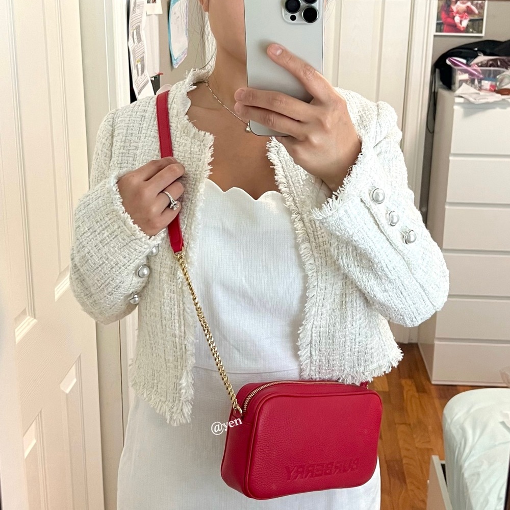 Burrberry  New Logo Embossed Elongated Camera EB9 leather crossbody bag